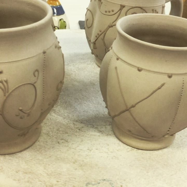 Cinderella coach mugs - a bit more slip trailing and they're ready for the kiln after their dry